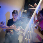 young teenage boy gets offered cannabis joint at a house party